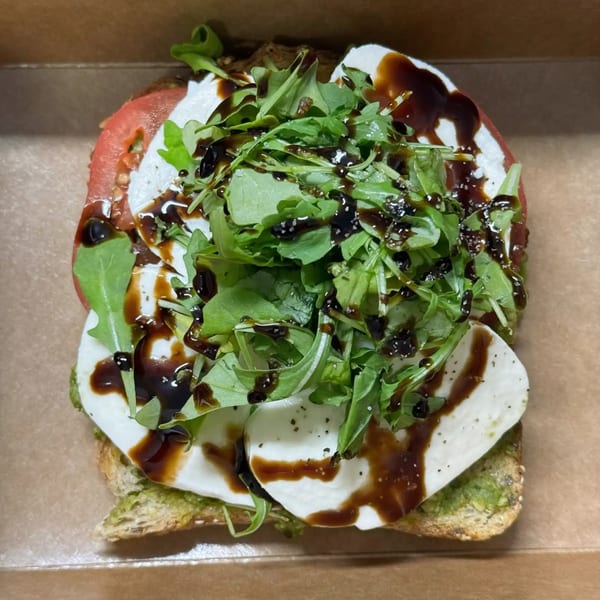 Good Hatch's Caprese toast with fresh mozzarella, tomato, arugula, and balsamic glaze.